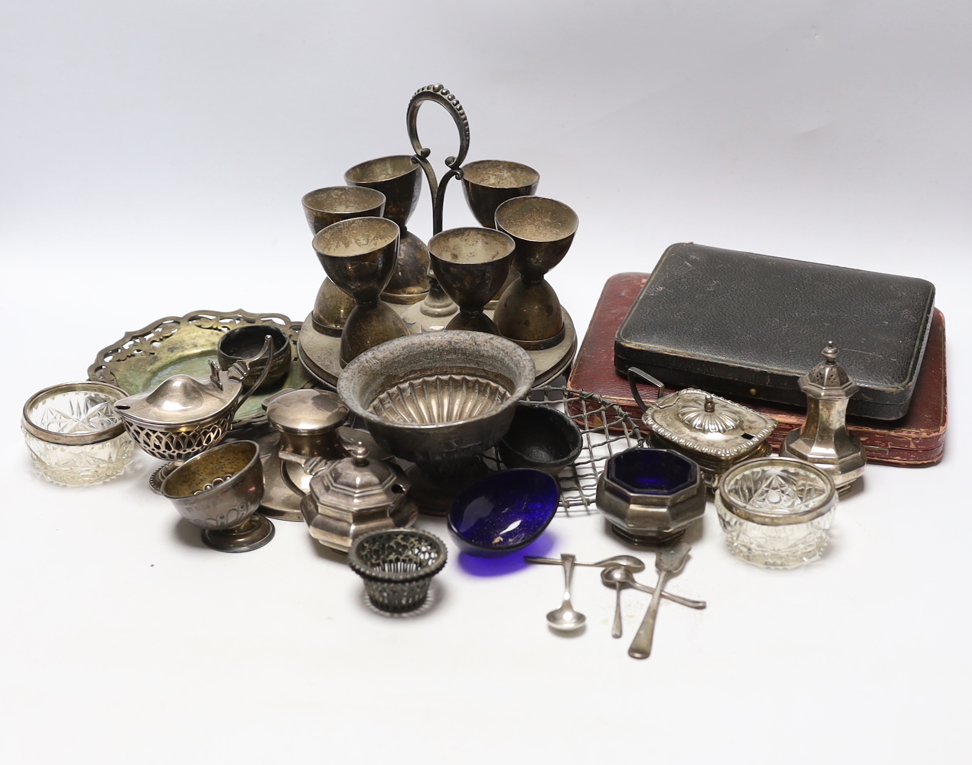 Sundry silver including three piece condiment set, two cased sets of teaspoons, five other condiments, salt spoons, pair of small pierced holders, inkwell and a small rose bowl, together with various plated items.